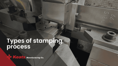 Close-up of industrial stamping process machinery at Keats Manufacturing.