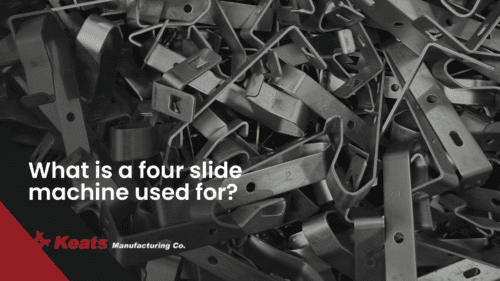 Close-up of various metal parts used in four-slide machines at Keats Manufacturing.
